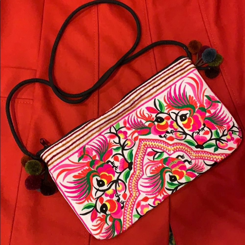 Unique embroidered bird cross body with pom poms